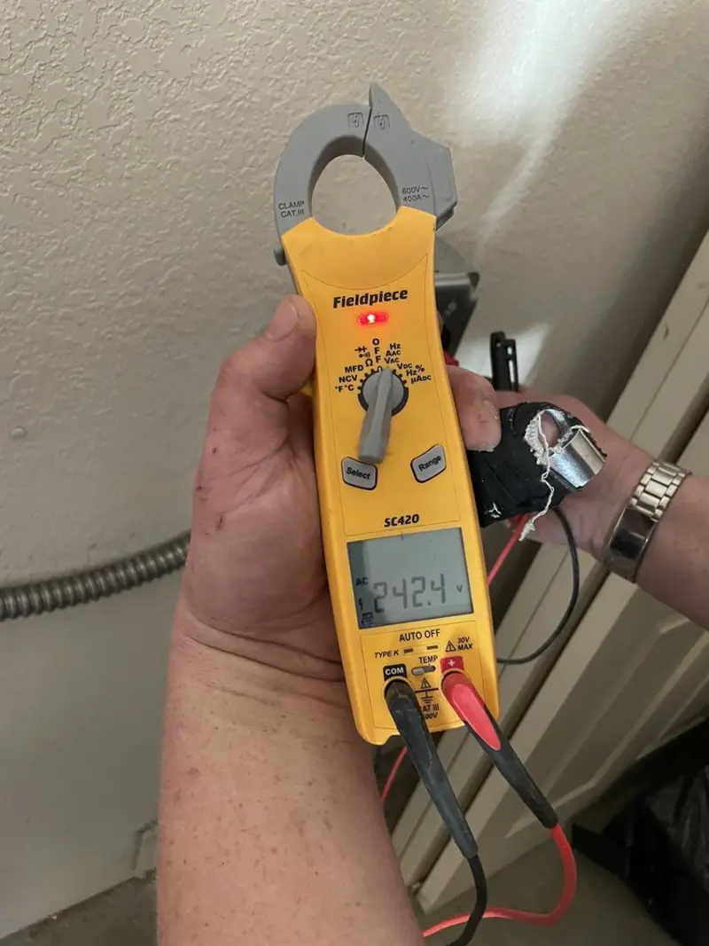 Voltage testing with clamp meter during Aluminum Wiring Replacement in Clarendon